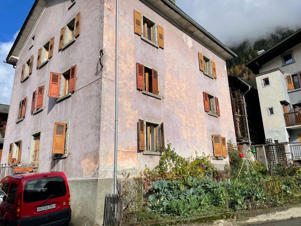 The existing Verbier chalet exterior at night