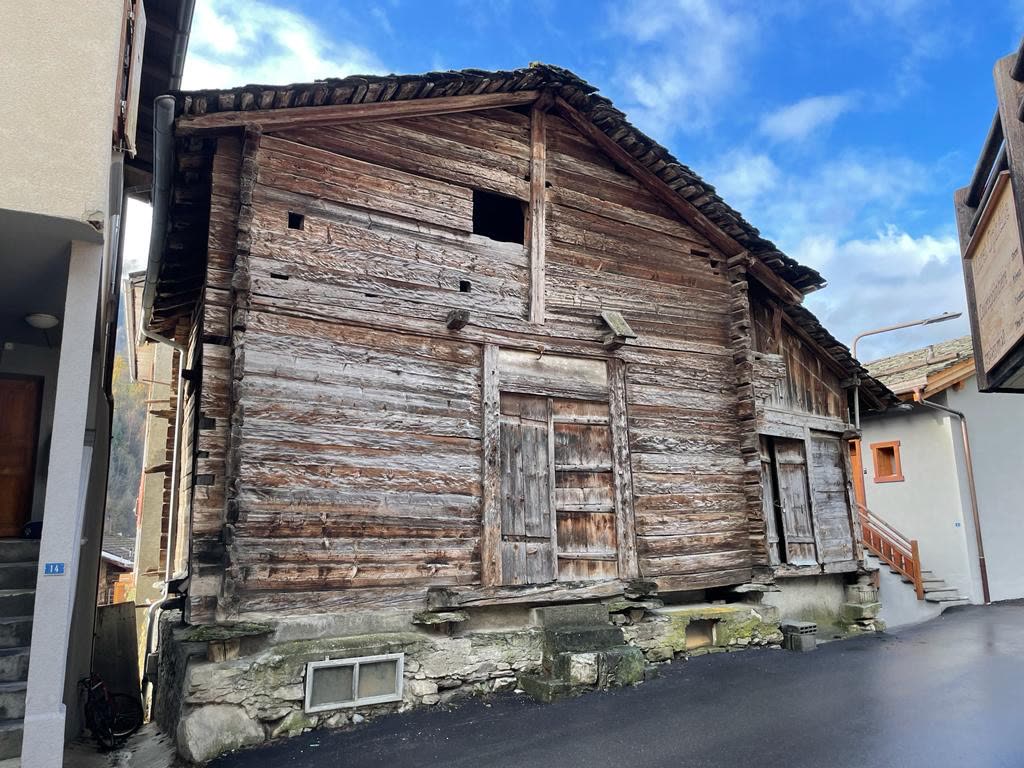 Existing living room with stone fireplace